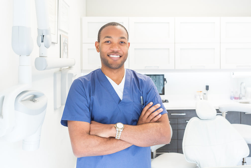 Friendly dentist in a modern clinic consulting with a patient, showcasing a professional and caring atmosphere